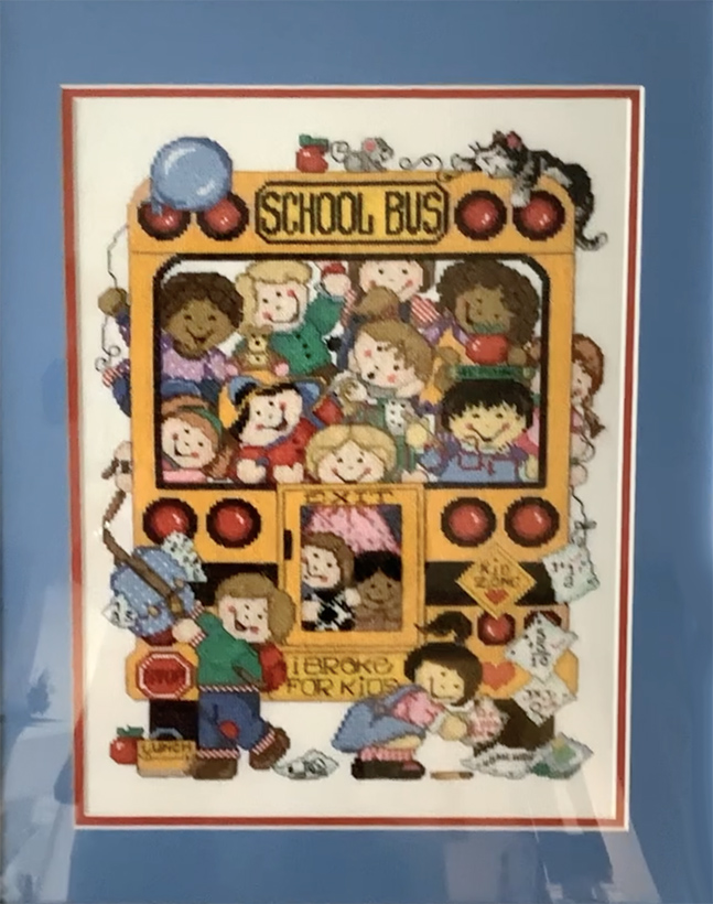photo of cross stitch with school bus and happy kids
